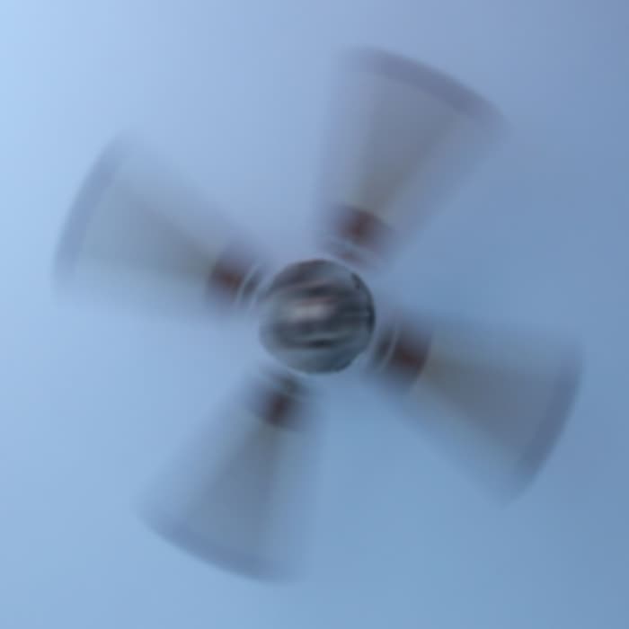 I barely opened my eyes to peer at the ceiling fan spinning above me. Instead of seeing the copper-colored medallion anchoring the faux-wooden blades, I noticed a furry bearded head with two horns staring at me.