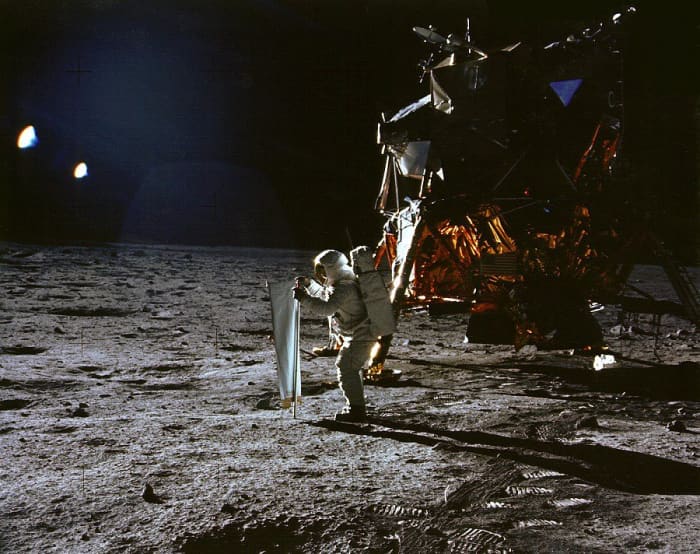 Apollo 11: Catching Some Sun. Here is the the Eagle and pilot Buzz Aldrin unfurling a long sheet of foil known as the Solar Wind Collector.
