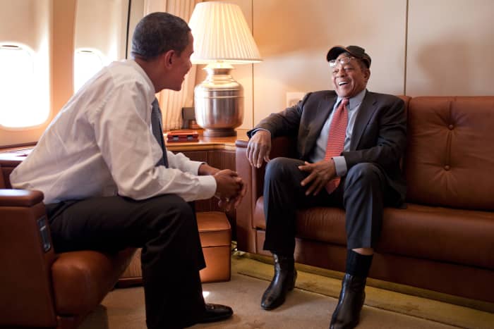 Former San Francisco Giants outfielder Willie Mays (right) talks with President Barack Obama aboard Air Force One en route to the 2009 Major League Baseball All-Star Game in St. Louis.