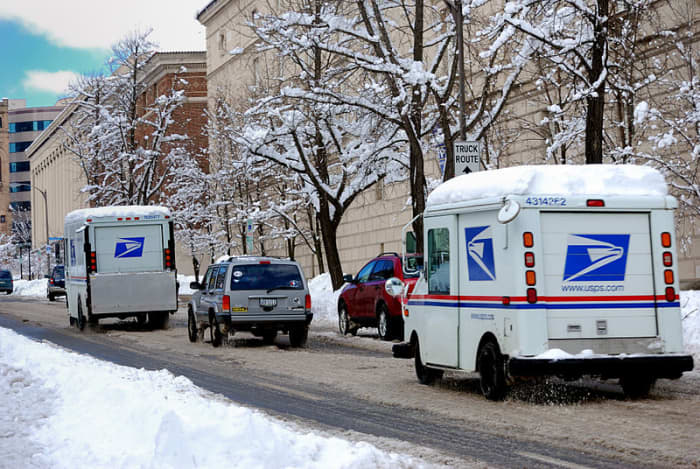 The Postal Service slogs ahead, through the snow, sleet, mud, sometimes smoke, into the New Year 2020.