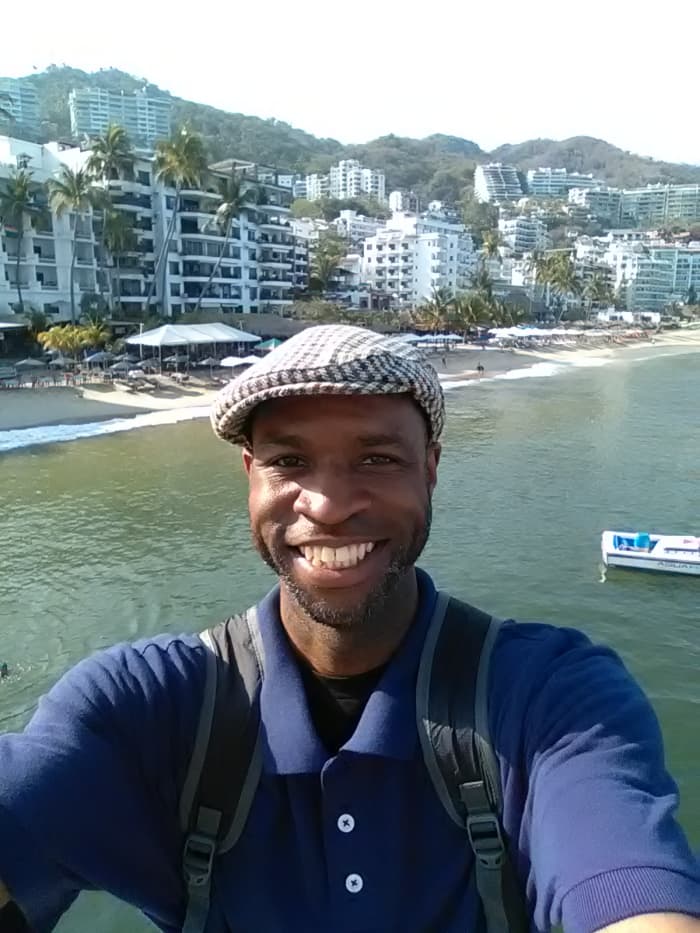 My online revenue streams allow me to be able to travel the world. Here I'm enjoying the sun and sand in Puerto Vallarta, Mexico