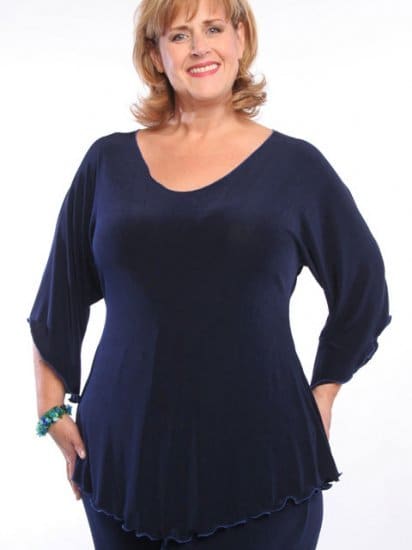 This tunic, with its deep neck and crease proof fabric, is ideal for a travel wardrobe. The shaped hemline makes it ideal for the plus size figure and helps to make legs look longer.