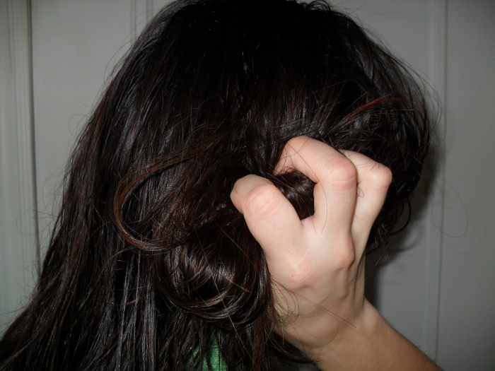 Scrunch gel into your hair to get waves