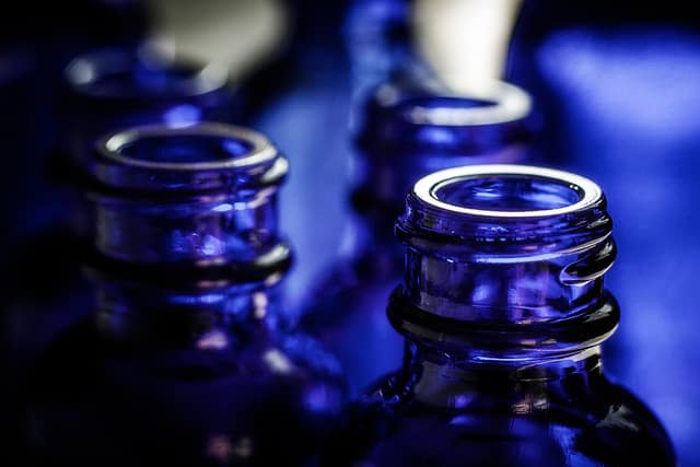 Keep your perfume and body spray in a dark, glass spray bottle.