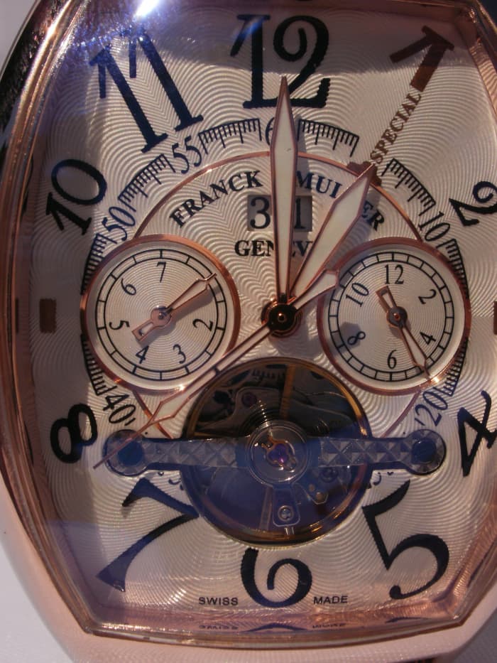 Information on dial fraudulently identifies the timepiece as being a Swiss made, Franck Muller watch manufactured in Geneva.
