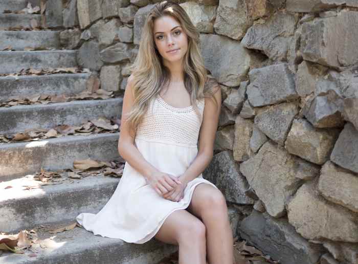 Young woman wearing light makeup suitable for her age, appearing natural and beautiful.