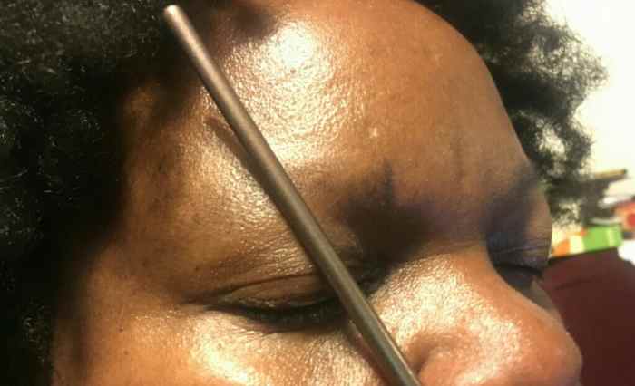 Step 2: Placing the mark for where the arch of the eyebrow will go.