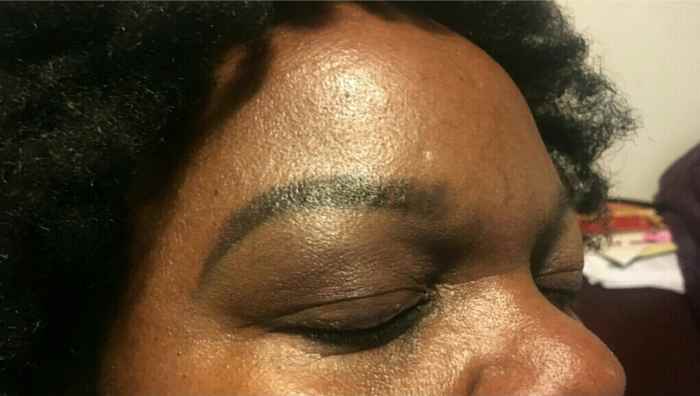 Step 7: Cleaning up the eyebrows using concealer.