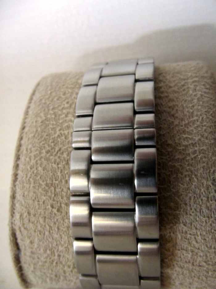 J. Brackett Navigli Automatic strap buckle secured 