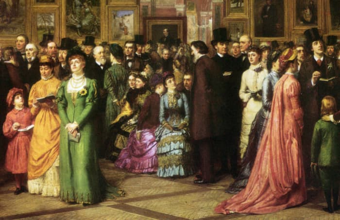 The man in the top hat at the right is Oscar Wilde. The woman in white beside him is Lillie Langtry. The woman on the right in pink Is wearing a Watteau back dress.