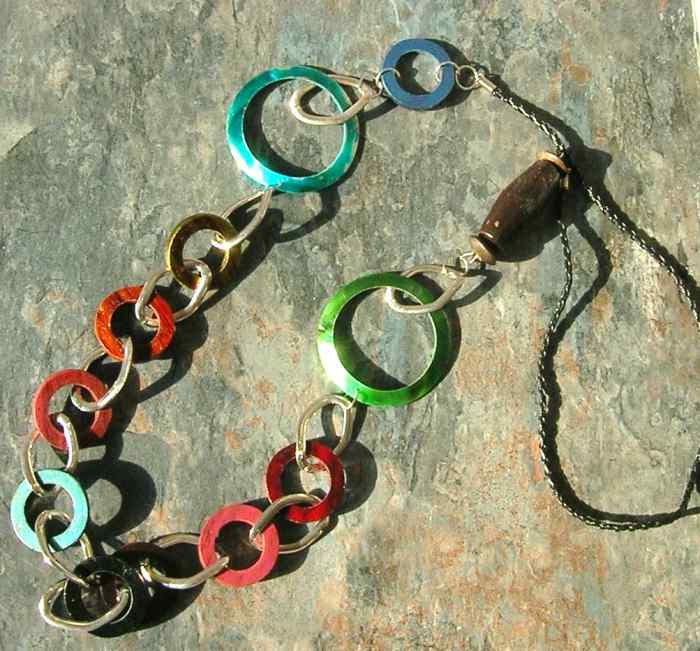 Accessorize your swimsuit with bold items, like this colorful boho necklace.