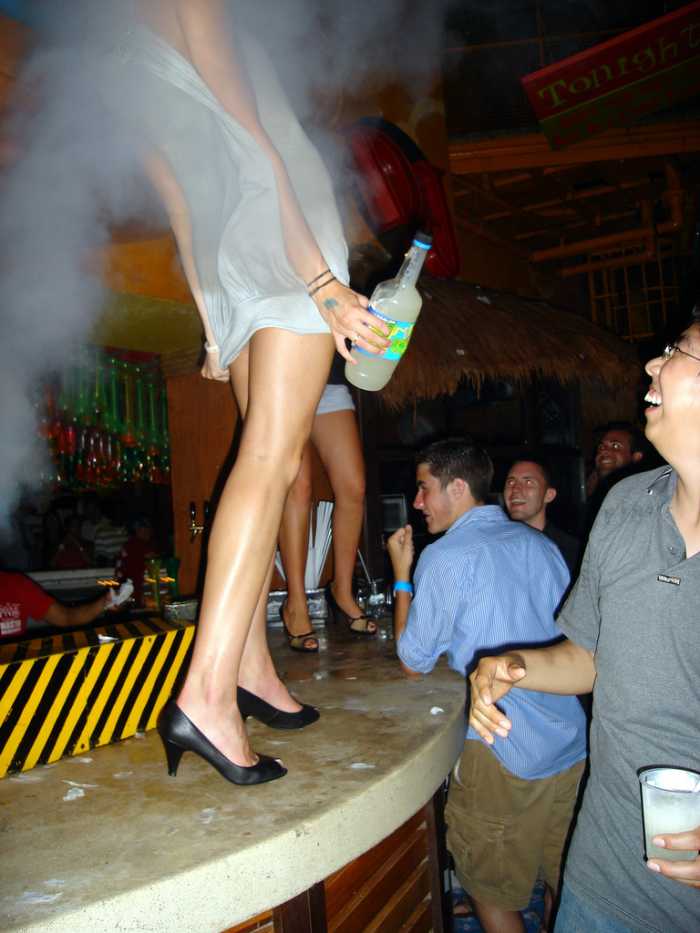 She's not slutty; she's just enjoying the smoke machine from a better vantage point.