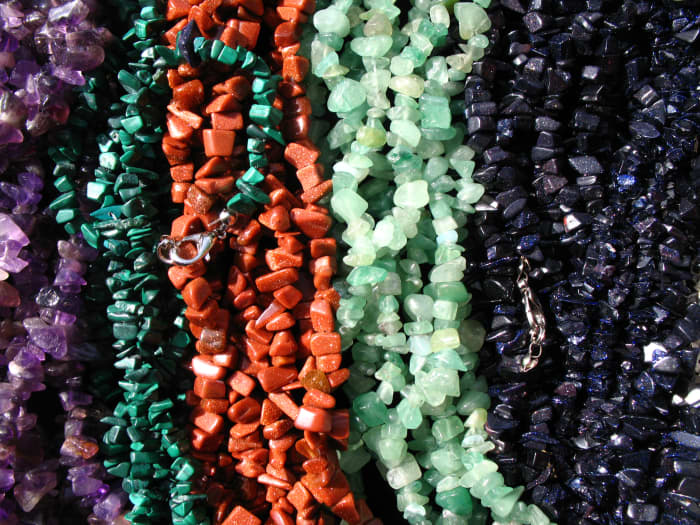 Jewelry makes a statement. Try to get necklaces that have texture and make sure the length is right for you.