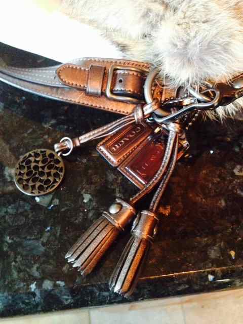 Real metal and leather Coach hang tags.