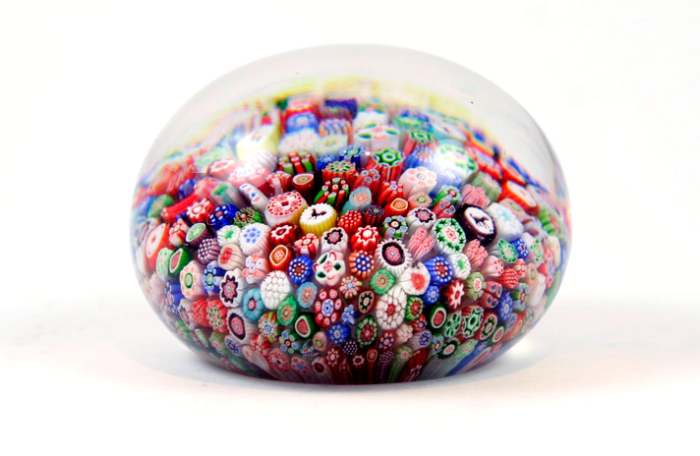 An antique baccarat millefiori paperweight with Gridel silhouette canes.