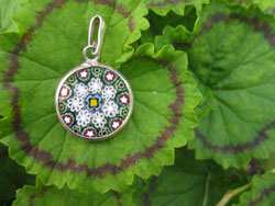 A small millefiori pendant matches any outfit.