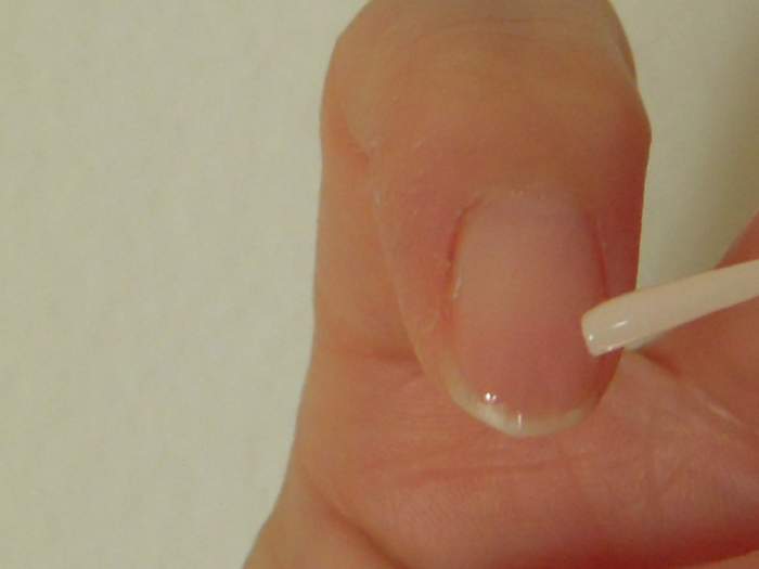 Apply pink polish on all nails.