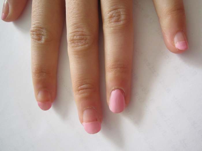We started with a pink french manicure and painted the ring finger to prep for its design.