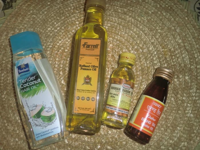 Hair oil concoction for the master product: coconut oil, olive oil, almond oil and castor oil.