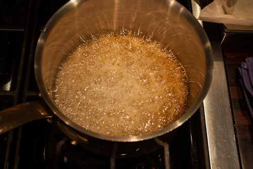 Boil the sugar until it bubbles and turns a nice auburn colour