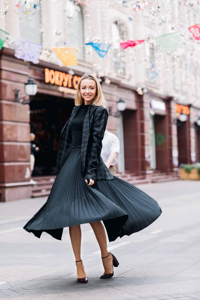 A midi-skirt and top can be paired with a blazer for a winter wedding.