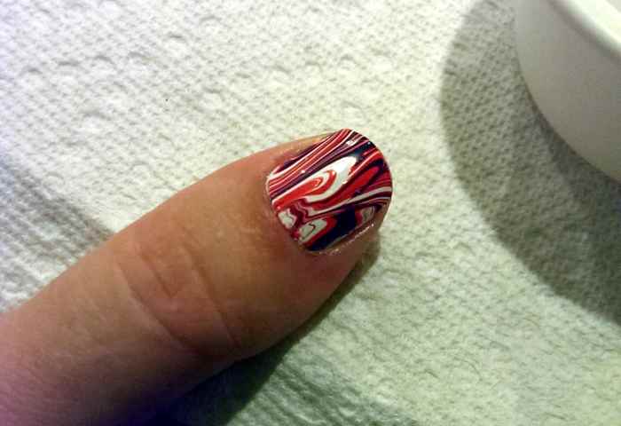 Clean up the edges with a Q-Tip and nail polish remover.