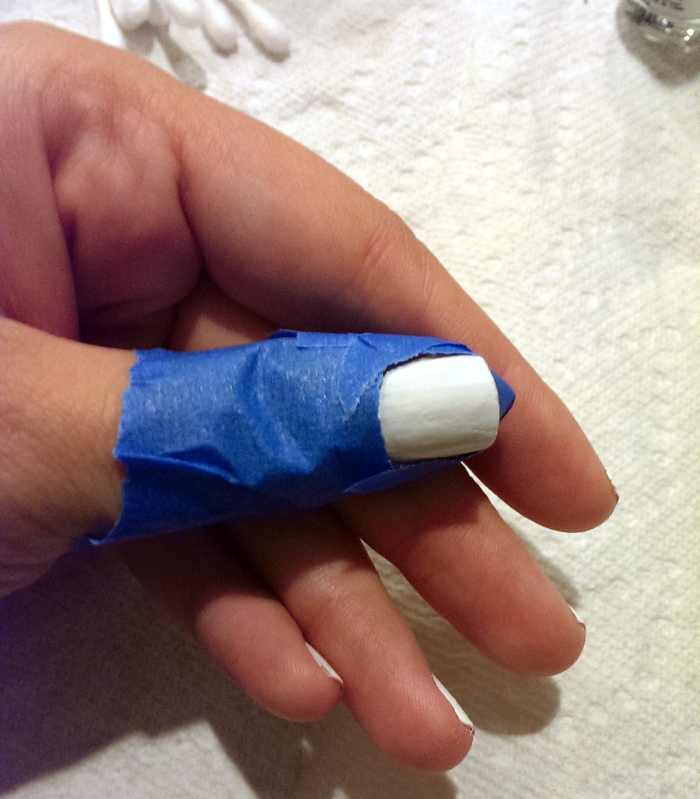 Painter's tape surrounding my nail all the way to my knuckle.