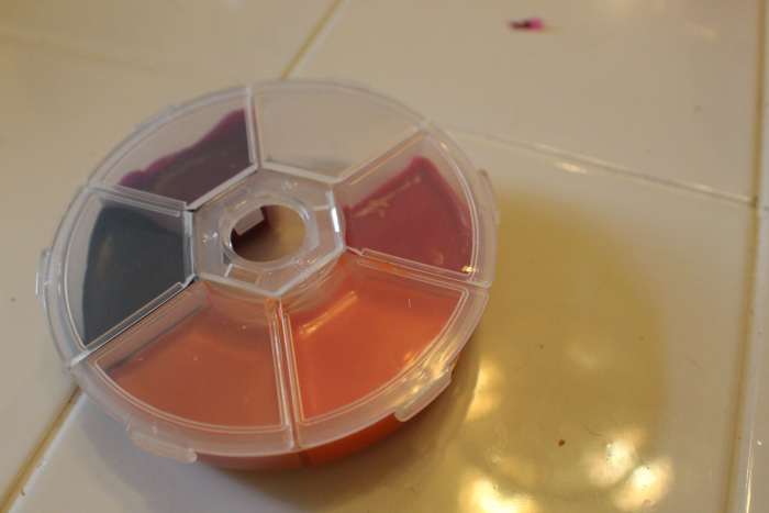 New lipsticks poured into the bead container. Five colors in, and then I had homework to do.