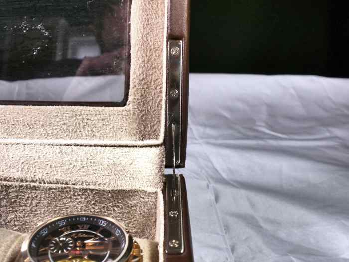 Hinges (with the assistance of gravity) are designed to hold the lid open.