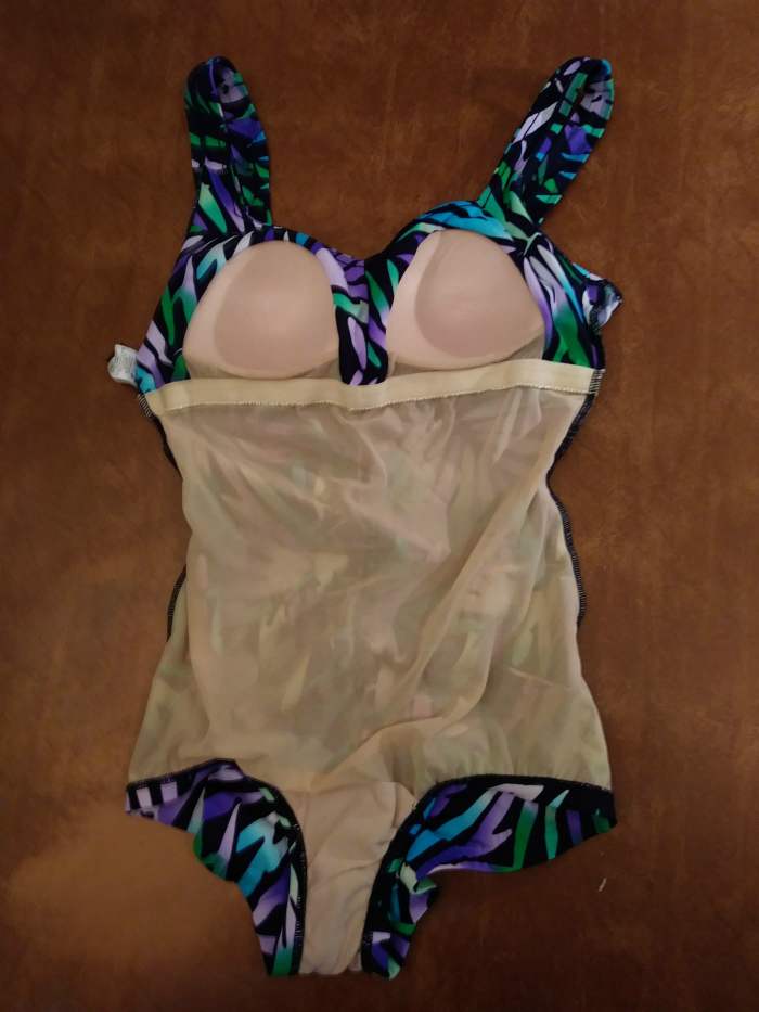Turn the swimsuit inside out to expose the shelf bra..