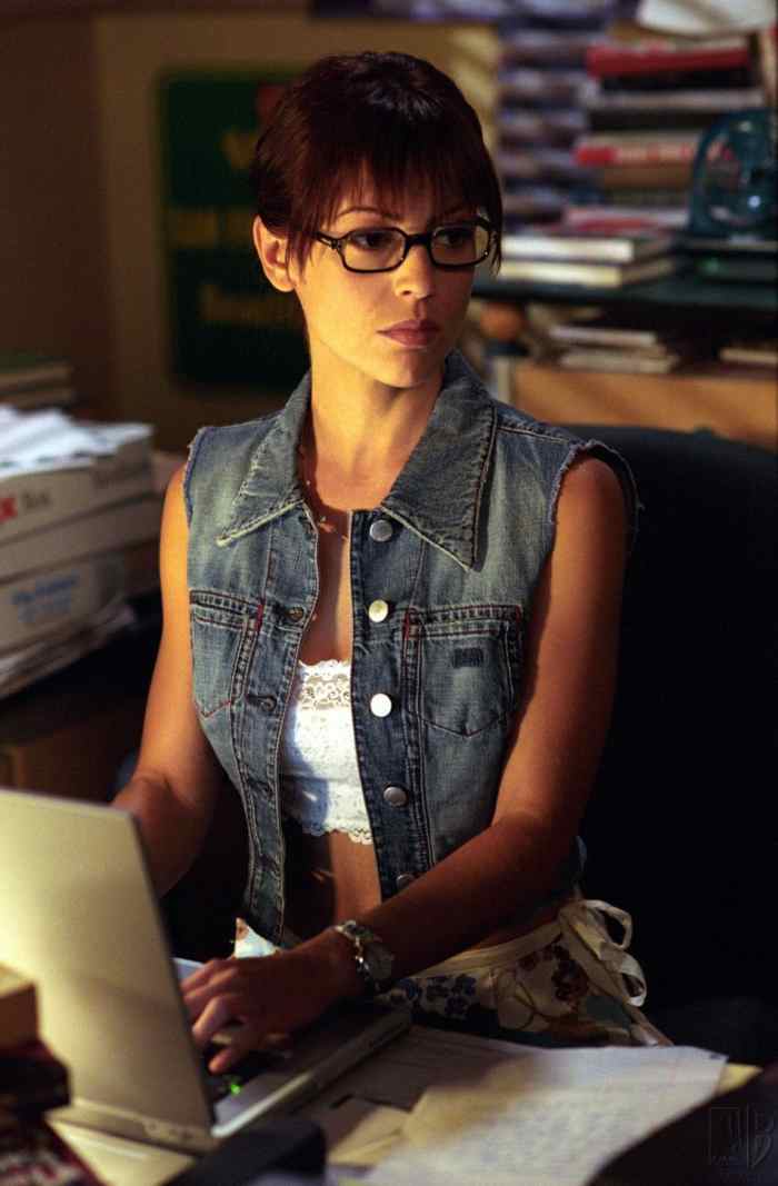 Denim vest and lace top.