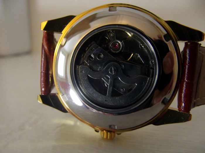 Automatic movement displayed through caseback of Sewor automatic wristwatch