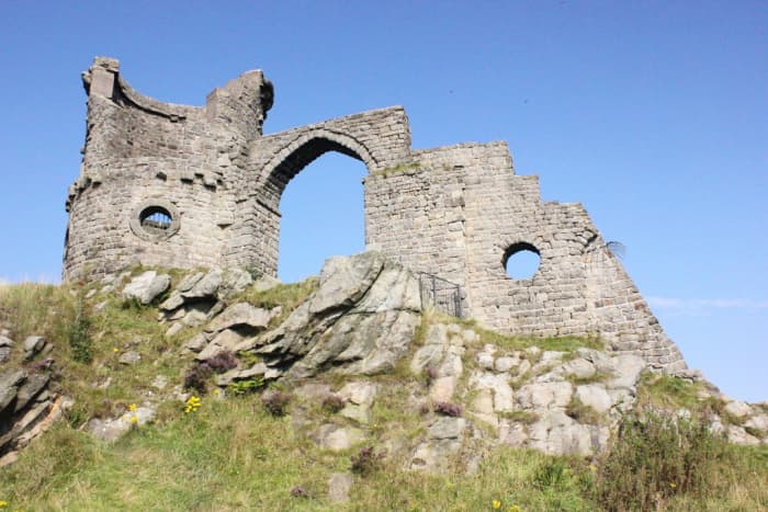 Mow Cop Castle in Cheshire, England is a folly that was built in 1754 to resemble a ruined medieval fort.