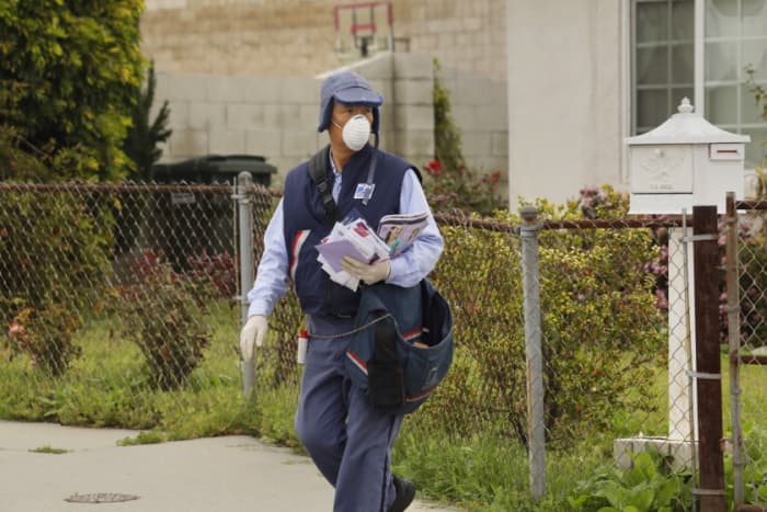 This SoCal letter carrier feverishly goes about his business, dodging dogs, and now, trying to avoid invisible, microscopic biters too.