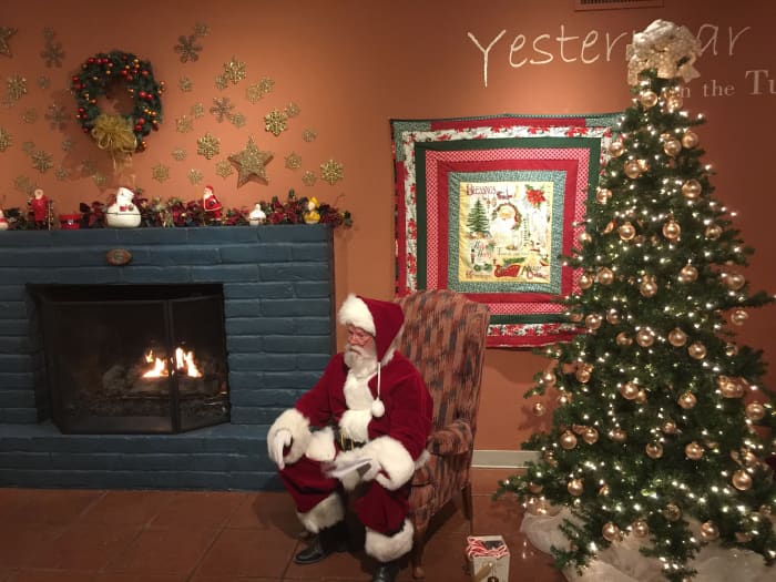 Here, Père Noël/Santa Claus is sitting by a fireplace waiting for children to come.