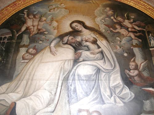 Mary nursing the baby Jesus...and a saint. Photo Credit http://www.flickr.com/photos/quinet/99603058/ under Creative Commons Attribution License