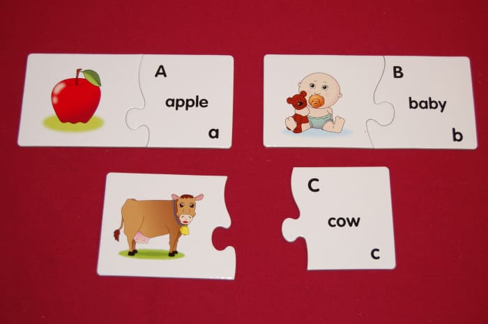 Two-piece puzzles with upper and lowercase letters with a word starting with that letter on one piece and a picture on other piece