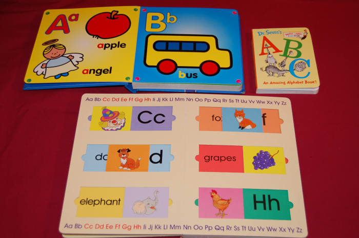 In the top left is my favorite alphabet book, which I got from Ross. I'm not crazy about the Dr Seuss alphabet book upper right.