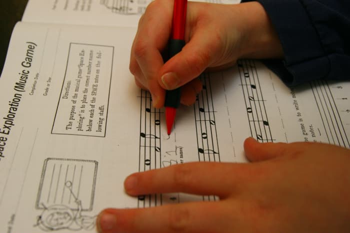 My son takes traditional piano lessons, and has homework every week in a "Keynote Speller." Ensure your child is developmentally ready for the type of music lessons you have chosen! Not every child would be ready for this type of music instruction.