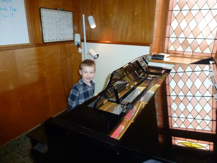 My kindergarten-aged son during a piano lesson - we booked a "test" session to see if he was old enough to learn music sight-reading.