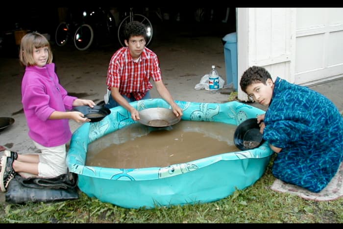 A bucket of gravel and sand from an old gold mining area was dumped into the kiddie pool. The grandchildren (ages 6-12) loved gold panning! Yeah, water and dirt!
