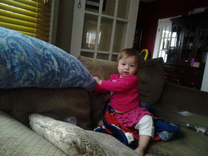 Young toddlers- the fast and the curious... "What, Mama? I'm just pulling down the blanket you just folded...."