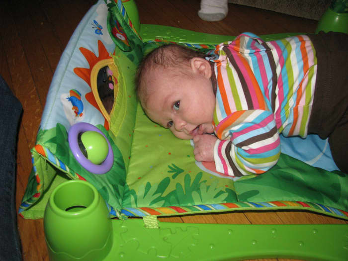 A tummy time mat gives a newborn a comfy and fun area to exercise the neck muscles.