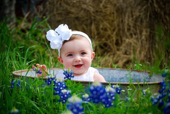 Baby Girl with White Bow in Old Fashioned Bathtub