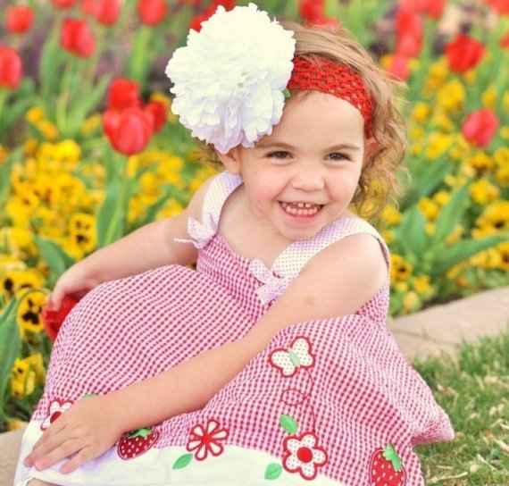 #3 Girl in Red Checked Dress Sitting Among Flowers