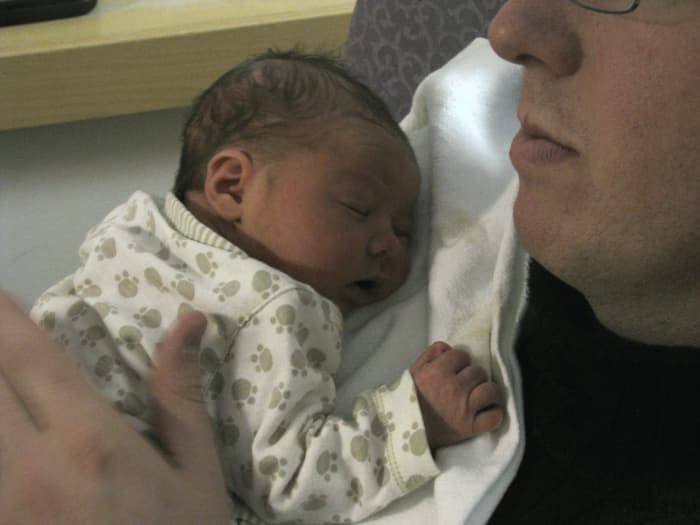 Be sure to support your newborn baby's head when you hold him or her for the first time.