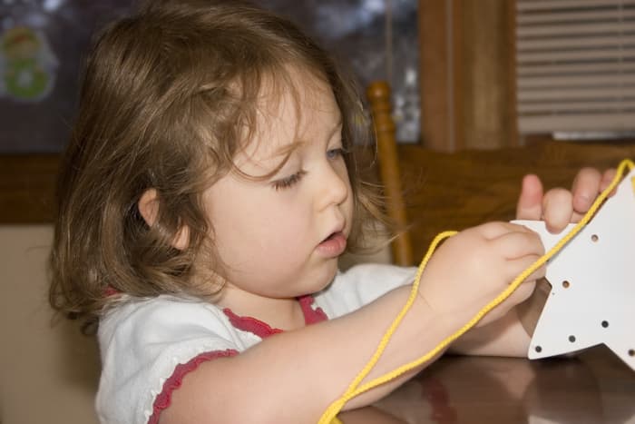 Simple activities such as stitching a star requires hand eye coordination and can go a long way to helping with fine motor skill development.