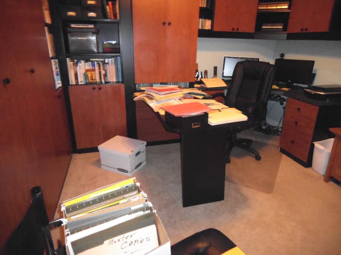 The cabinets hide the amount of family history stored in this room It needs to be thinned down to a more compact amount.