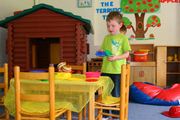 Pretending to cook and serve food with a play kitchen will increase a child's language skills.