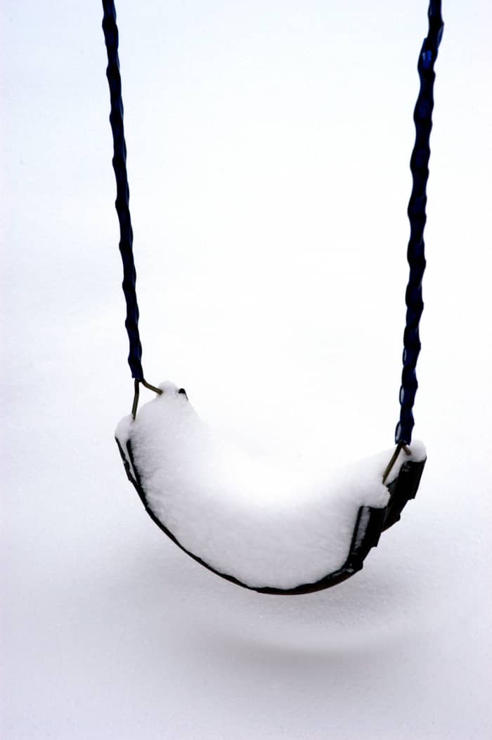 photo credit Glenn Mcgloughlin Don't brush the snow off yet, swinging on a swing is not a good idea.
